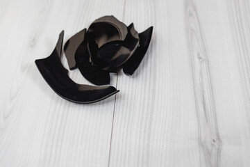 Black shards of a broken plate