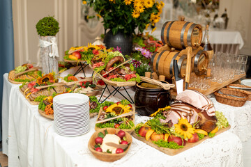  Beautifully served buffet with cold appetizers of national cuisine in restaurant hall for festive event. Recreation and entertainment. Tourism and travel .