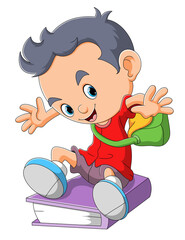 The naughty boy is sitting on the thick book