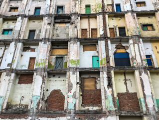 Fototapeta na wymiar a fragment of a building with a demolished external wall