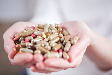 different pills in the hands