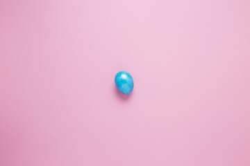 Multi-colored Easter eggs on a pink isolated background. Easter is a bright holiday.