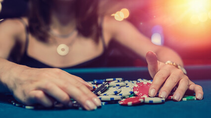 female player checking how much winning at casino poker game