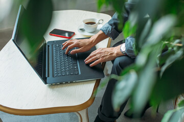 young Asian girl business style clothes, with a laptop