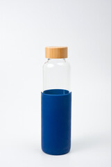 Stylish glass water bottle with wooden lid. For fitness and travel.