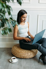 young Asian girl business style clothes, with a laptop