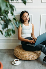 young Asian girl business style clothes, with a laptop
