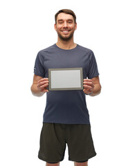 fitness, sport and healthy lifestyle concept - smiling man in sports clothes holdng tablet pc computer over white background