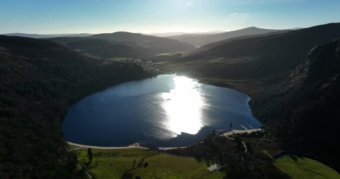 Lough Tay, Wicklow, Ireland. January 2022 Drone pulls north away from the Guinness lake with the Vikings set on the northern shore with Cloghoge River and Roundwood in the distance.