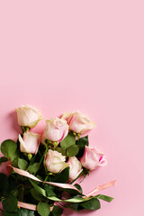 Flat lay with roses on pink background, valentines day and mothers day concept