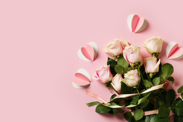 Flat lay with roses on pink background, valentines day and mothers day concept