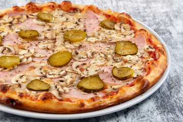 fresh pizza on the white plate