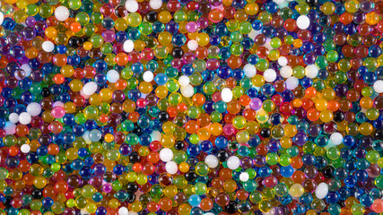 Water beads close-up, abstract background. Texture of Hydrogel balls or many colorful orbeez for...