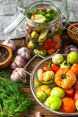 Pickled Tomatoes in Jar with Herbs. Healthy Preserved Food