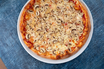 fresh pizza on the white plate