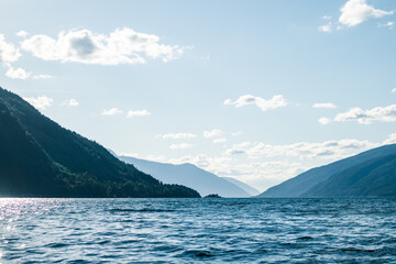 A beautiful view of the Norway fjord from the sea level. Autumn landscape of fjords in Northern Europe.
