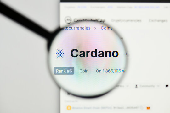 Milan, Italy - January 11, 2022: cardano - ADA website's hp.  cardano, ADA coin logo visible through a loope. Defi, ntf, cryptocurrency concepts illustrative editorial.