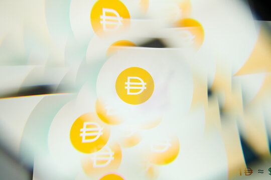 Milan, Italy - January 11, 2022: dai - DAI logo on laptop screen seen through an optical prism. Dynamic and unique image form dai, DAI coin website. Illustrative editorial.