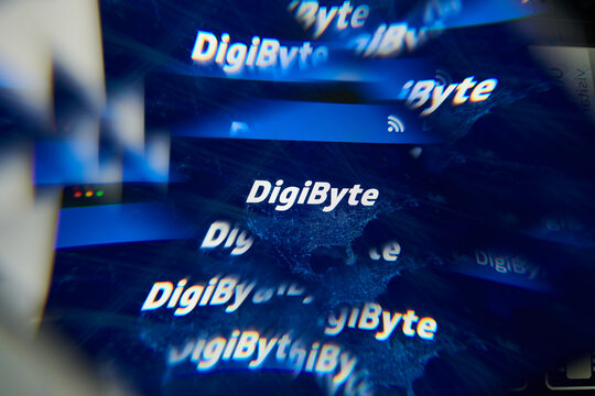 Milan, Italy - January 11, 2022: digibyte - DGB logo on laptop screen seen through an optical prism. Dynamic and unique image form digibyte, DGB coin website. Illustrative editorial.