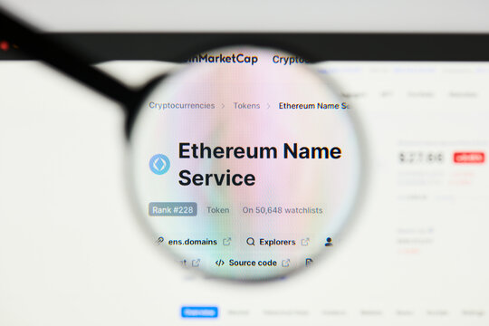 Milan, Italy - January 11, 2022: ethereum name service - ENS website's hp.  ethereum name service, ENS coin logo visible through a loope. Defi, ntf, cryptocurrency concepts illustrative editorial.