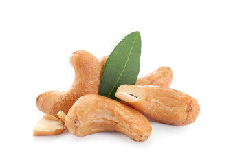 Tasty organic cashew nuts and green leaf isolated on white