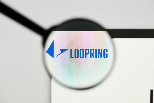 Milan, Italy - January 11, 2022: loopring - LRC website's hp.  loopring, LRC coin logo visible through a loope. Defi, ntf, cryptocurrency concepts illustrative editorial.