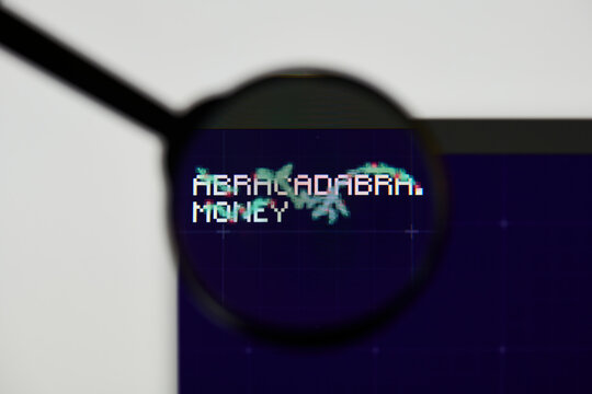 Milan, Italy - January 11, 2022: magic internet money - MIM website's hp.  magic internet money, MIM coin logo visible through a loope. Defi, ntf, cryptocurrency concepts illustrative editorial.