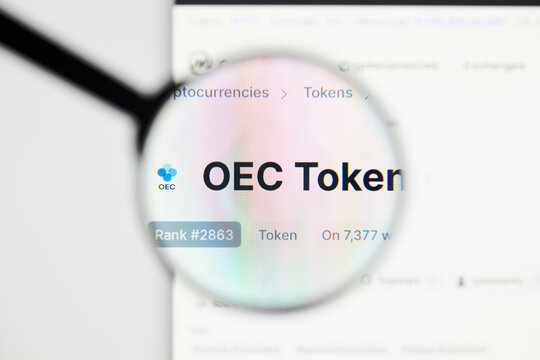 Milan, Italy - January 11, 2022: oec token - OKT website's hp.  oec token, OKT coin logo visible through a loope. Defi, ntf, cryptocurrency concepts illustrative editorial.