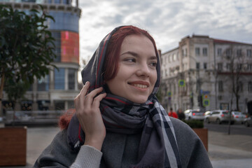 Fototapeta premium Outdoor lifestyle portrait of amazing glamorous luxury woman posing in city center.