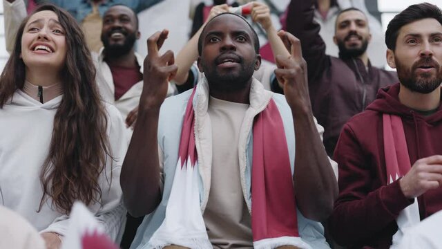 African american guy watching with excitement football match