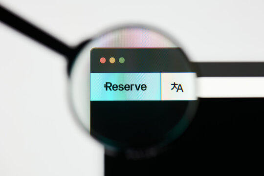 Milan, Italy - January 11, 2022: reserve rights token - RSR website's hp.  reserve rights token, RSR coin logo visible through a loope. Defi, ntf, cryptocurrency concepts illustrative editorial.
