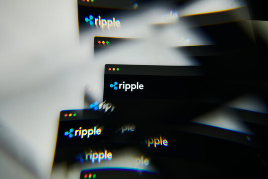 Milan, Italy - January 11, 2022: Ripple logo on laptop screen seen through an optical prism. Dynamic and unique image form Ripple coin website. Illustrative editorial.