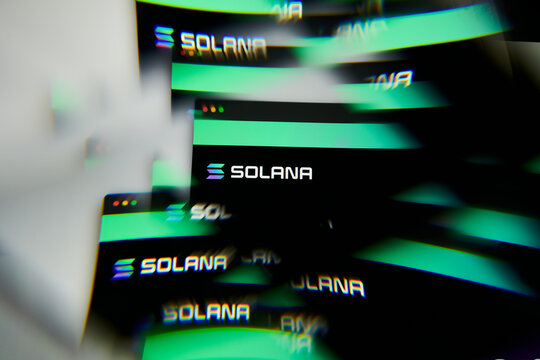 Milan, Italy - January 11, 2022: solana - SOL logo on laptop screen seen through an optical prism. Dynamic and unique image form solana, SOL coin website. Illustrative editorial.