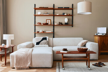 Modern interior of living room with design modular beige sofa, coffee table,  furniture, pendant...