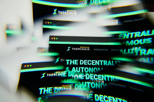 Milan, Italy - January 11, 2022: thorchain - RUNE logo on laptop screen seen through an optical prism. Dynamic and unique image form thorchain, RUNE coin website. Illustrative editorial.