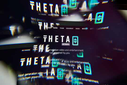 Milan, Italy - January 11, 2022: theta network - THETA logo on laptop screen seen through an optical prism. Dynamic and unique image form theta network, THETA coin website. Illustrative editorial.