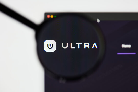 Milan, Italy - January 11, 2022: ultra - UOS website's hp.  ultra, UOS coin logo visible through a loope. Defi, ntf, cryptocurrency concepts illustrative editorial.