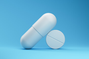 Two pills on a blue background. Medicine and pharmacology concept. 3d rendering