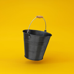 Iron bucket black floating on a yellow background, 3d render