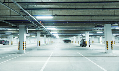 Horizontal image of clean white underground parking lot