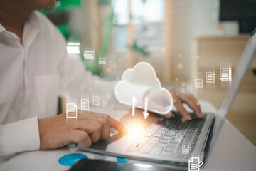 man use Laptop with cloud computing diagram show on hand. Cloud technology. Data storage. Networking and internet service concept. - obrazy, fototapety, plakaty