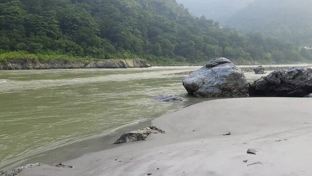 Morning view at GOA beach located in Rishikesh Uttarakhand near Laxman Jhula, Clean view of Ganga river at Rishikesh during early morning time, World famous GANGA river full view