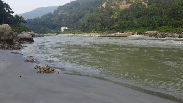 Morning view at GOA beach located in Rishikesh Uttarakhand near Laxman Jhula, Clean view of Ganga river at Rishikesh during early morning time, World famous GANGA river full view