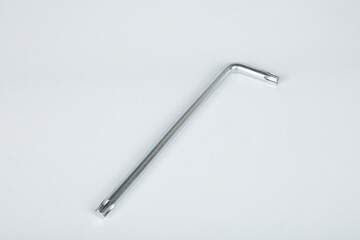 Hex metal Allen L key over white isolated background