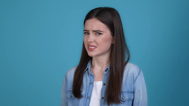 Lady show stop sign not like smell isolated blue color background