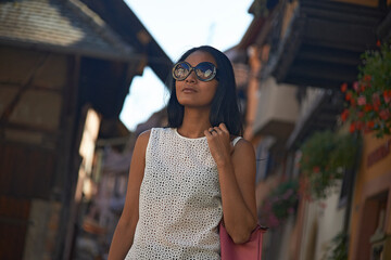 Asian woman enjoying sightseeing in the narrow streets of Paris