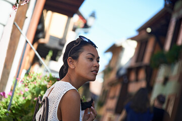 Asian woman enjoying sightseeing in the narrow streets of Paris