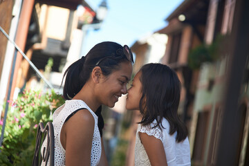 Asian mother and her young daughter in a sweet intimate moment