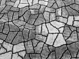 brick pattern texture on the floor in the park It looks like cracked soil gives a feeling of drought. The background gives a feeling of drought.