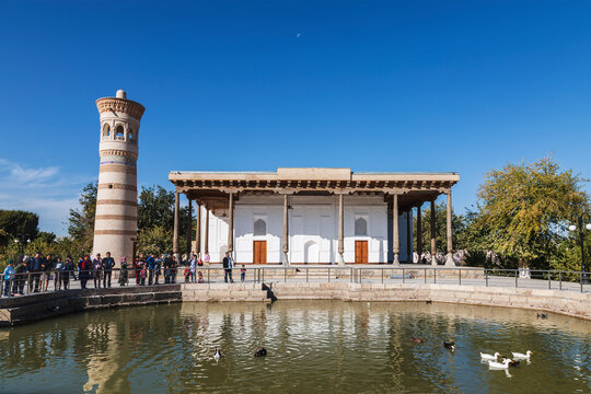 View of the building of the memorial complex of Bahauddin Nakshbandi. Muslim pilgrimage center and a pond in front of it. Suburb of Bukhara, Uzbekistan